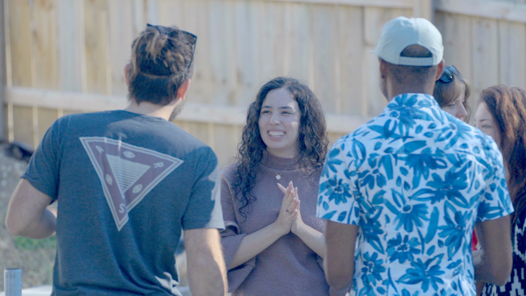 People conversing at the Castle Studios 1 year anniversary party.