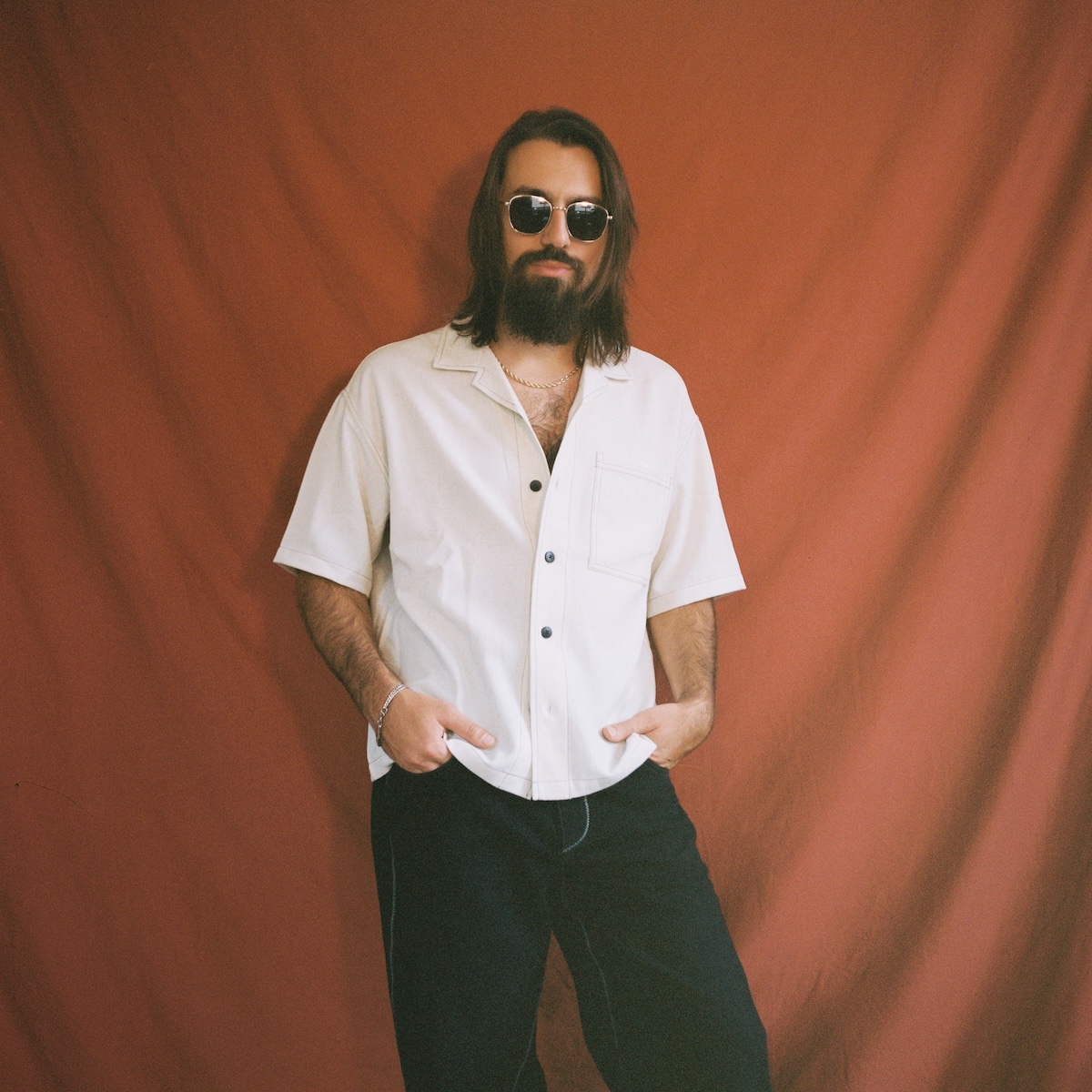 Vincent Orsolini in white shirt and sunglasses.